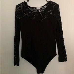 A long sleeve body suit